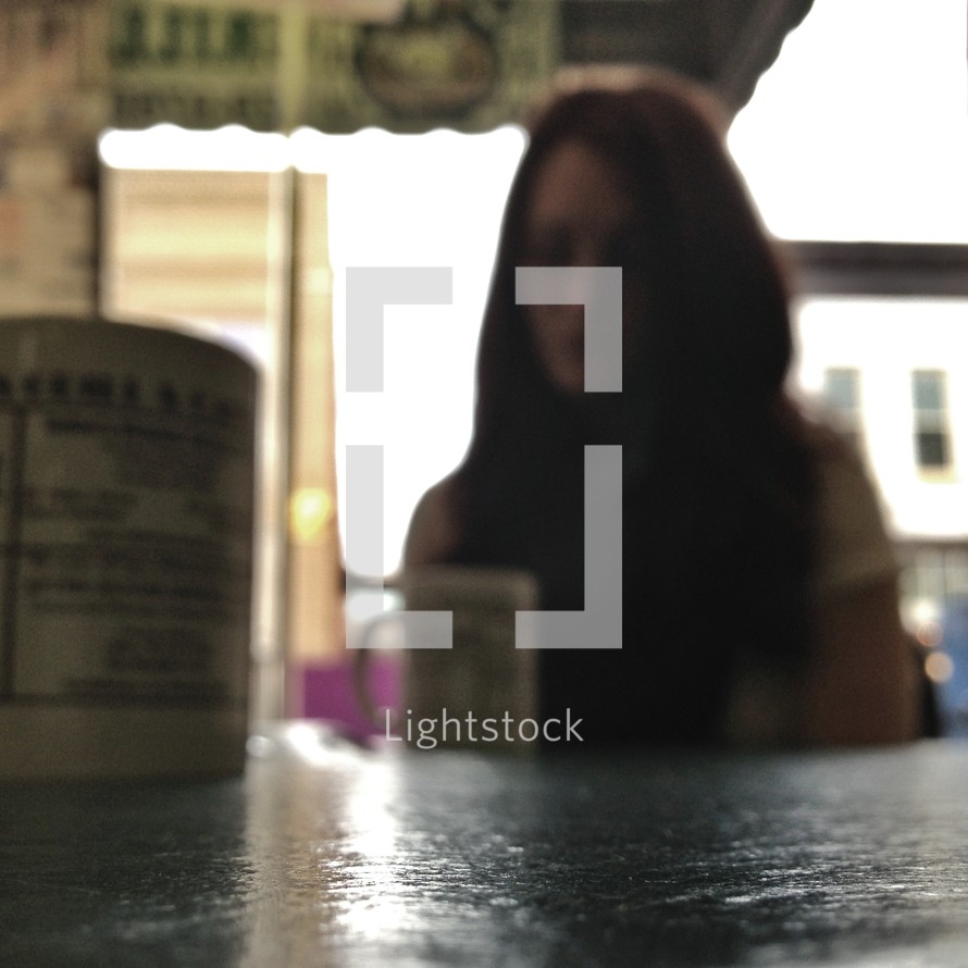 woman sitting in a coffee shop