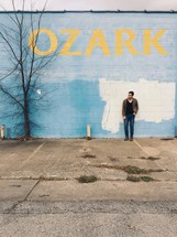 a man leaning against a wall and OZARK 