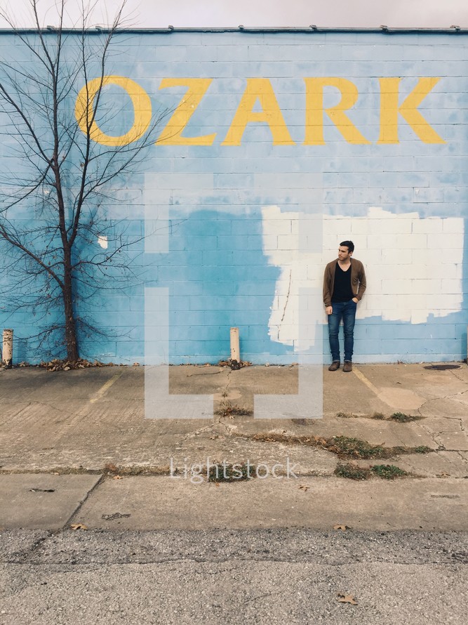 a man leaning against a wall and OZARK 