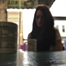 woman sitting in a coffee shop