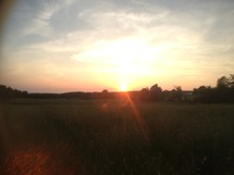 sunset over a field 