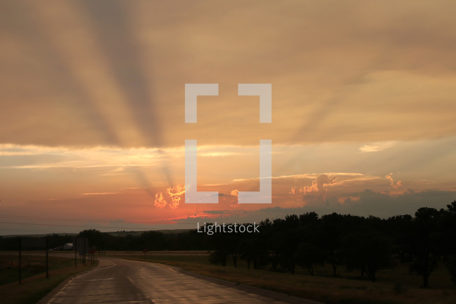 sunset over a rural road 