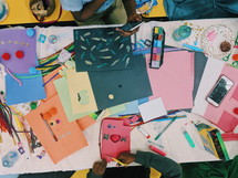 children coloring and cutting paper 