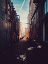 dumpsters in an alley 