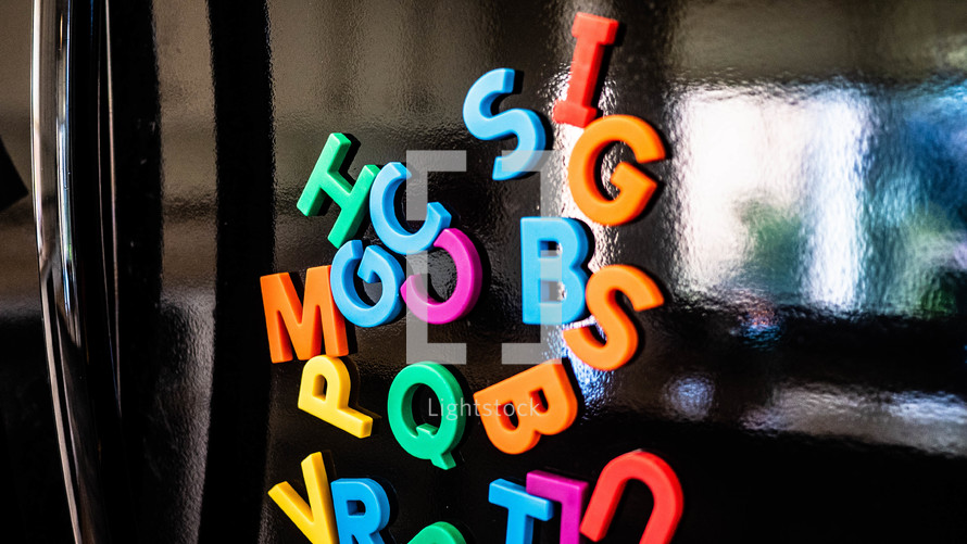 Alphabet magnets on a refrigerator