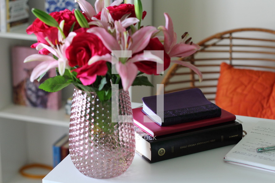 lilies in a vase and notes in a journal 