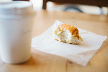 coffee cup and bread on a napkin 