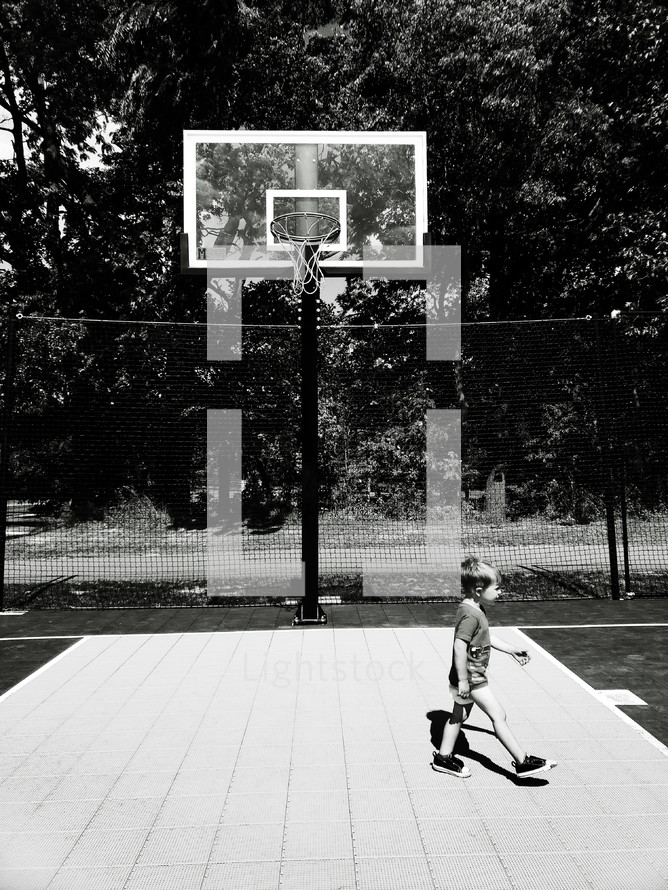 toddler on a basketball court 
