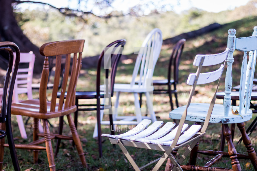 collection of chairs in rows outdoors 