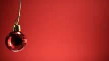 Red Christmas ball with red Background