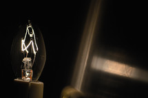 glowing filaments in a lightbulb  
