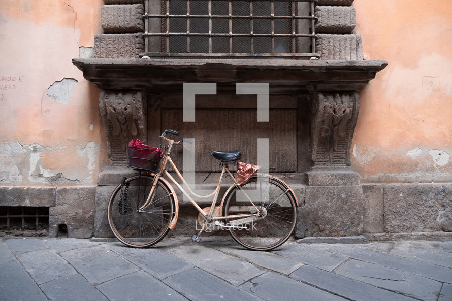 bike leaning against a wall 