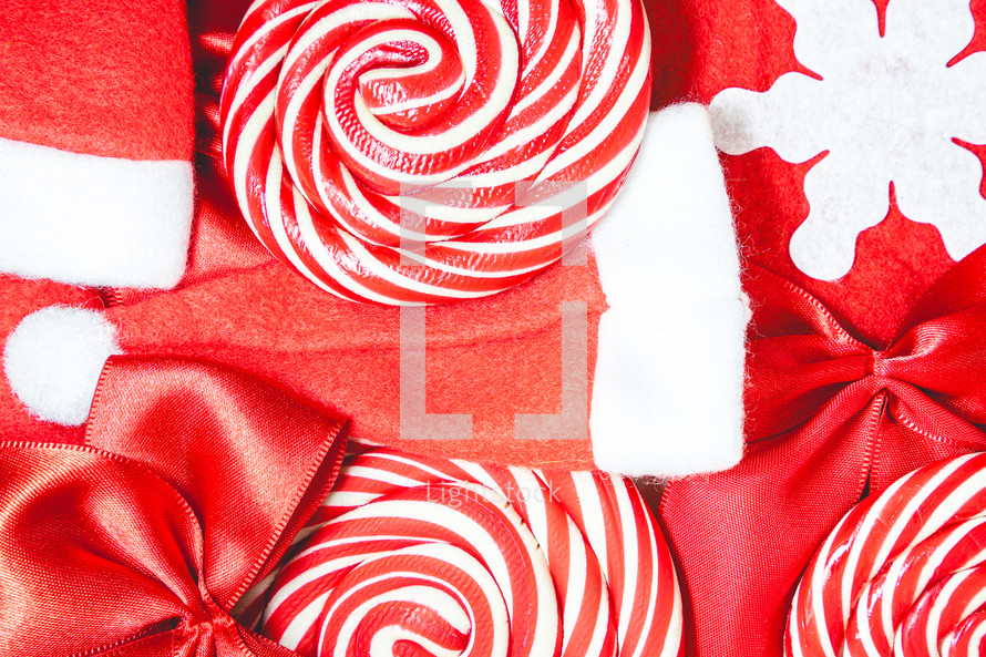 Flatlay of some red Christmas decoration, on a white background. Background for Christmas.