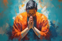 Portrait of a young man in bright orange praying.