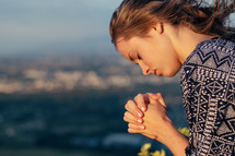 a praying young woman 