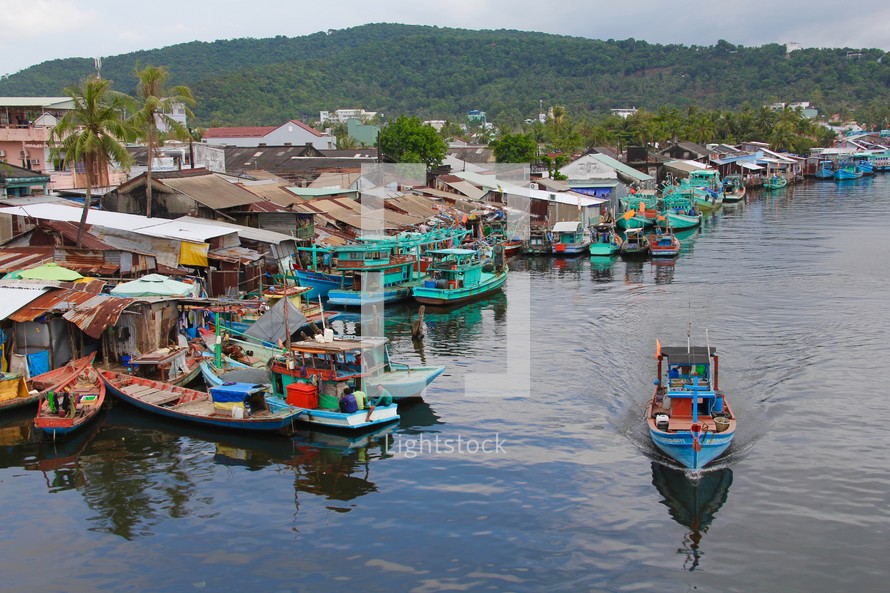 boats on a channel in a fishing village 