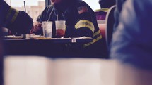 firefighters eating in a cafe 
