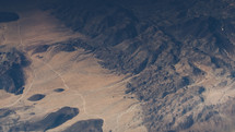 aerial view above jagged mountains 