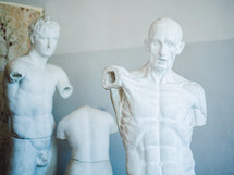 plaster statue of a human, artist studio. students studying how to draw people