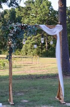 arch at an outdoor wedding 