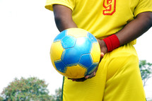man holding a soccer ball 