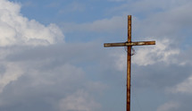 cross with crown of thorns against the sky 