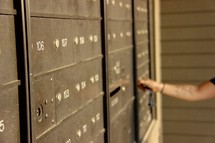 a woman checking her mail 