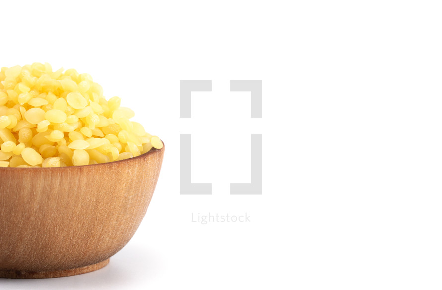 A Bowl of Natural Yellow Beeswax Pearls