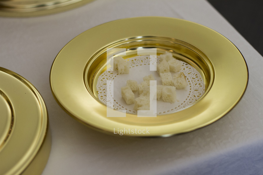 bread cubes in a communion tray