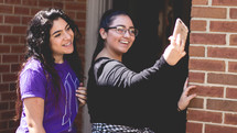 teen girls taking a selfie 