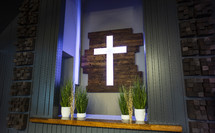 illuminated cross at an altar 