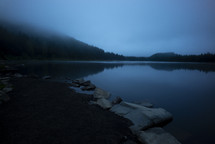 Morning fog rests over Trillium Lake a lake at dawn, Oregon