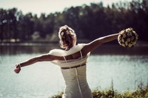 bride stretching near a lake 