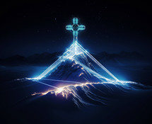 Cross on top of mountain with glowing rays on dark background. Religion concept