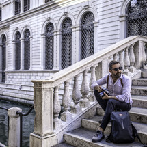 a man traveling in Venice, Italy 