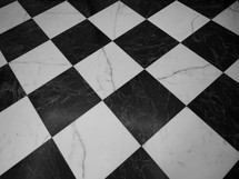 Black and white checked floor useful as a background