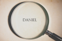 magnifying glass over Daniel 