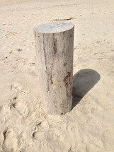 Post in the sand.