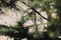 girl child climbing a tree 