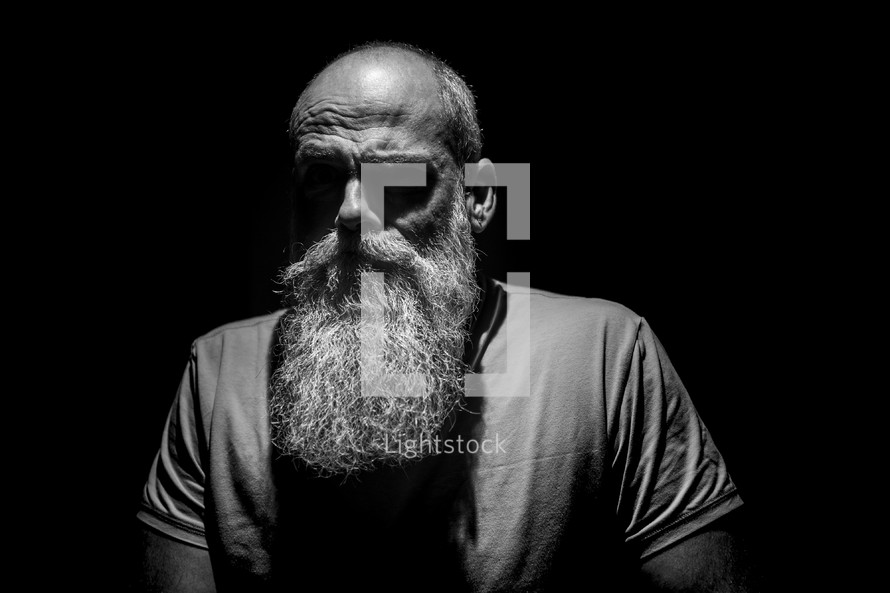 bearded mature man head shot 