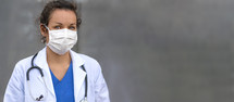 female doctor in a surgical mask 