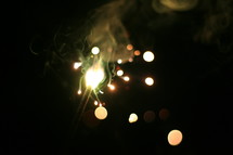 playing with sparklers on the 4th of july