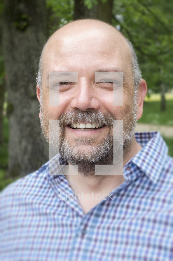 headshot of a bearded man 