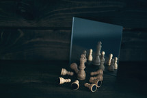 chess pieces in a mirror 