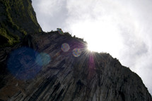 sunburst over the side of a mountain 
