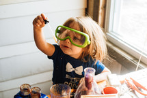 a toddler doing science experiments 