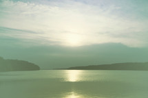 sunlight reflecting on lake water