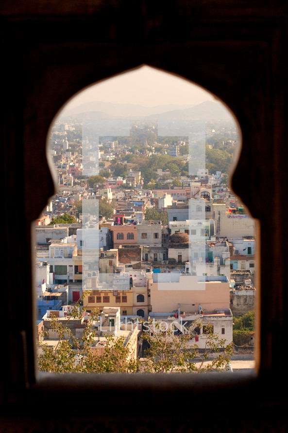 view of a shanty town in India through a window 