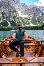 a man paddling a rowboat 