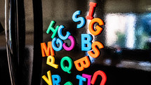 Alphabet magnets on a refrigerator